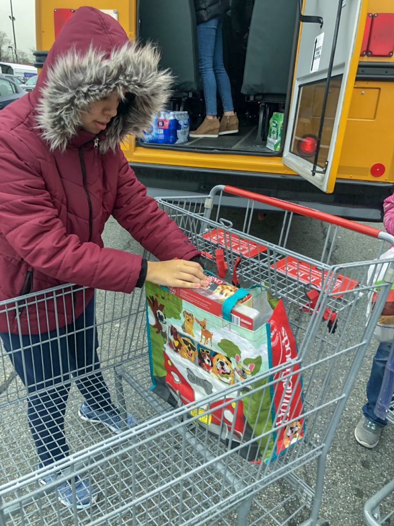 Ivana unloading a cart after shopping
