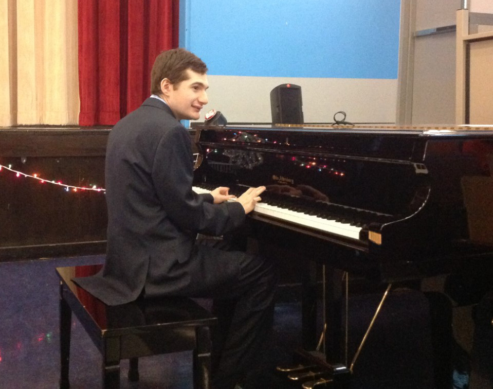 Rafael playing the piano at the Holiday Show.
