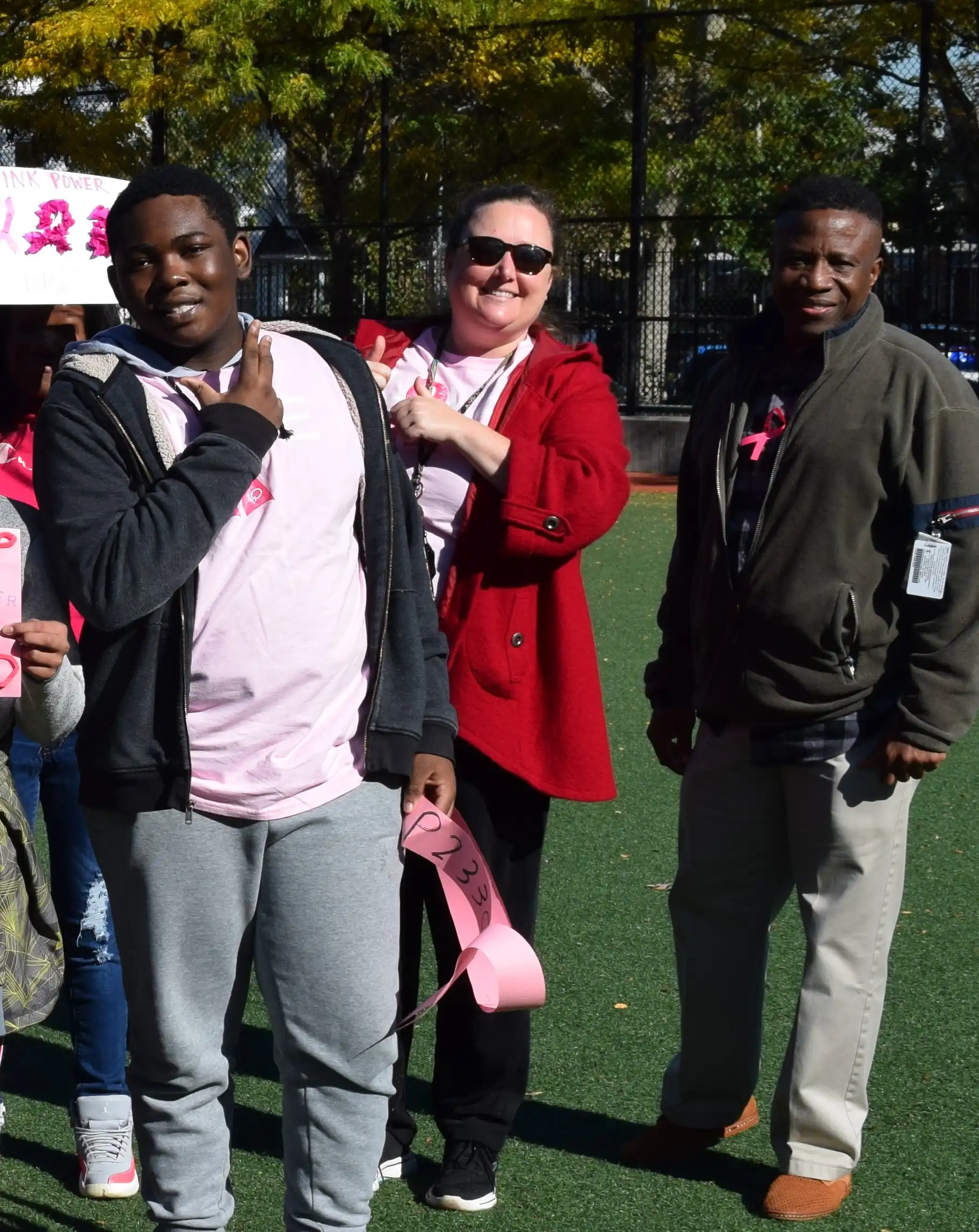 Samuel and his teachers wearing pink during the Breast Cancer Fundraiser Walkathon